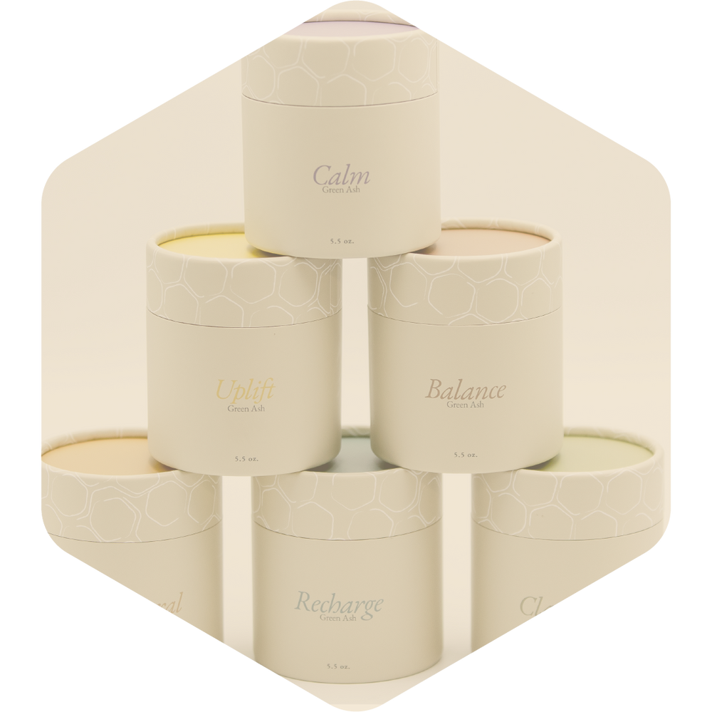 Green Ash's candles are stacked on top of each other like a pyramid. There are 6 of them, in their kraft tube packaging.